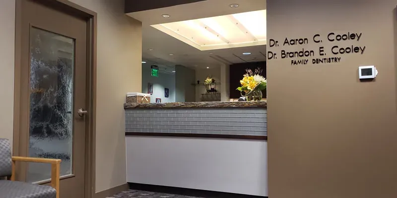 The Cooley Smiles reception, with the practice name on the wall.
